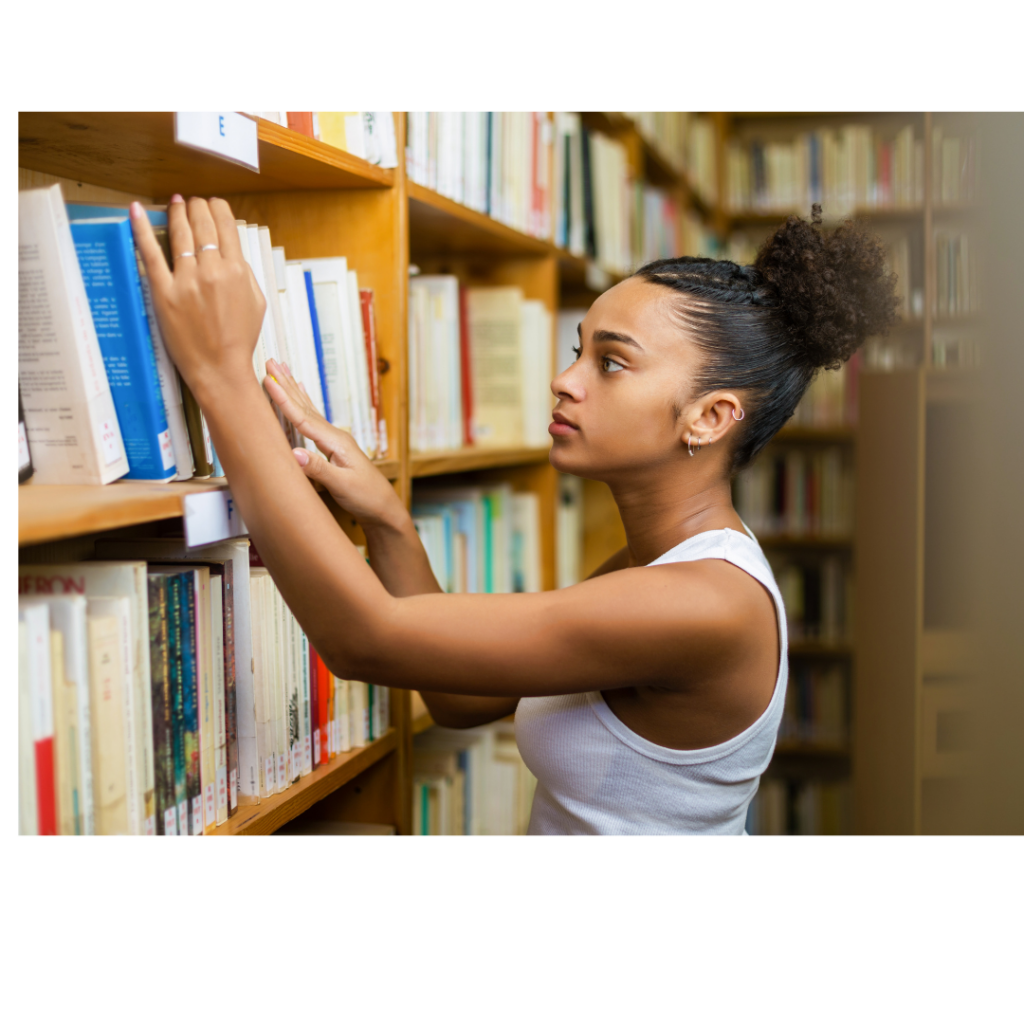 African American girl looking at a bookself indicating she is getting a good education and not focused on a life partner.