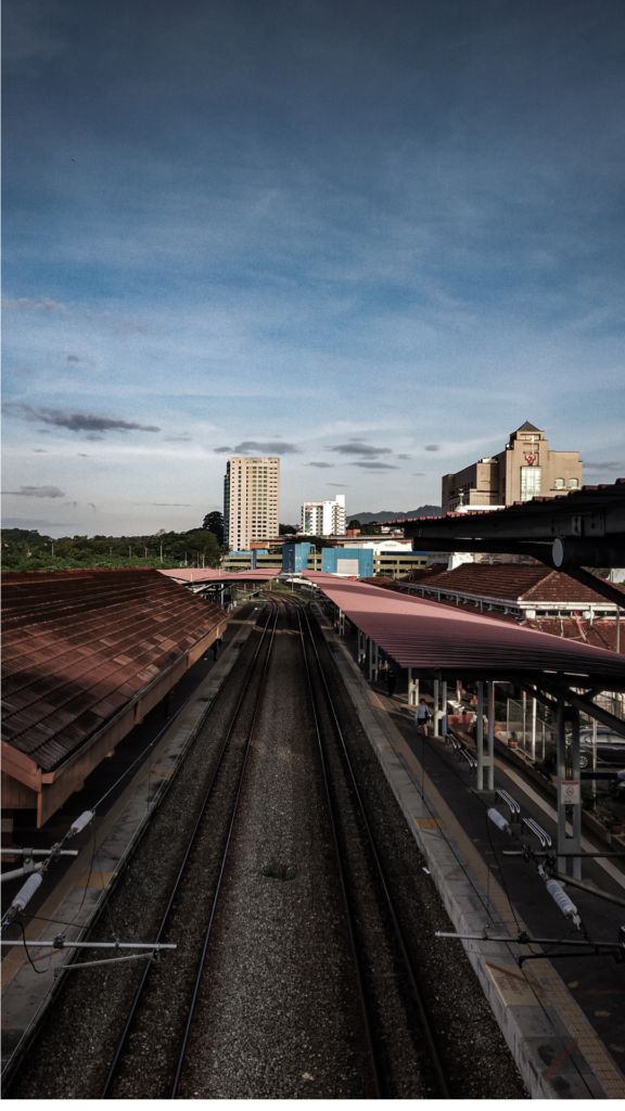 city skyline view of a train station. The imagery indicates that you can live anywhere.